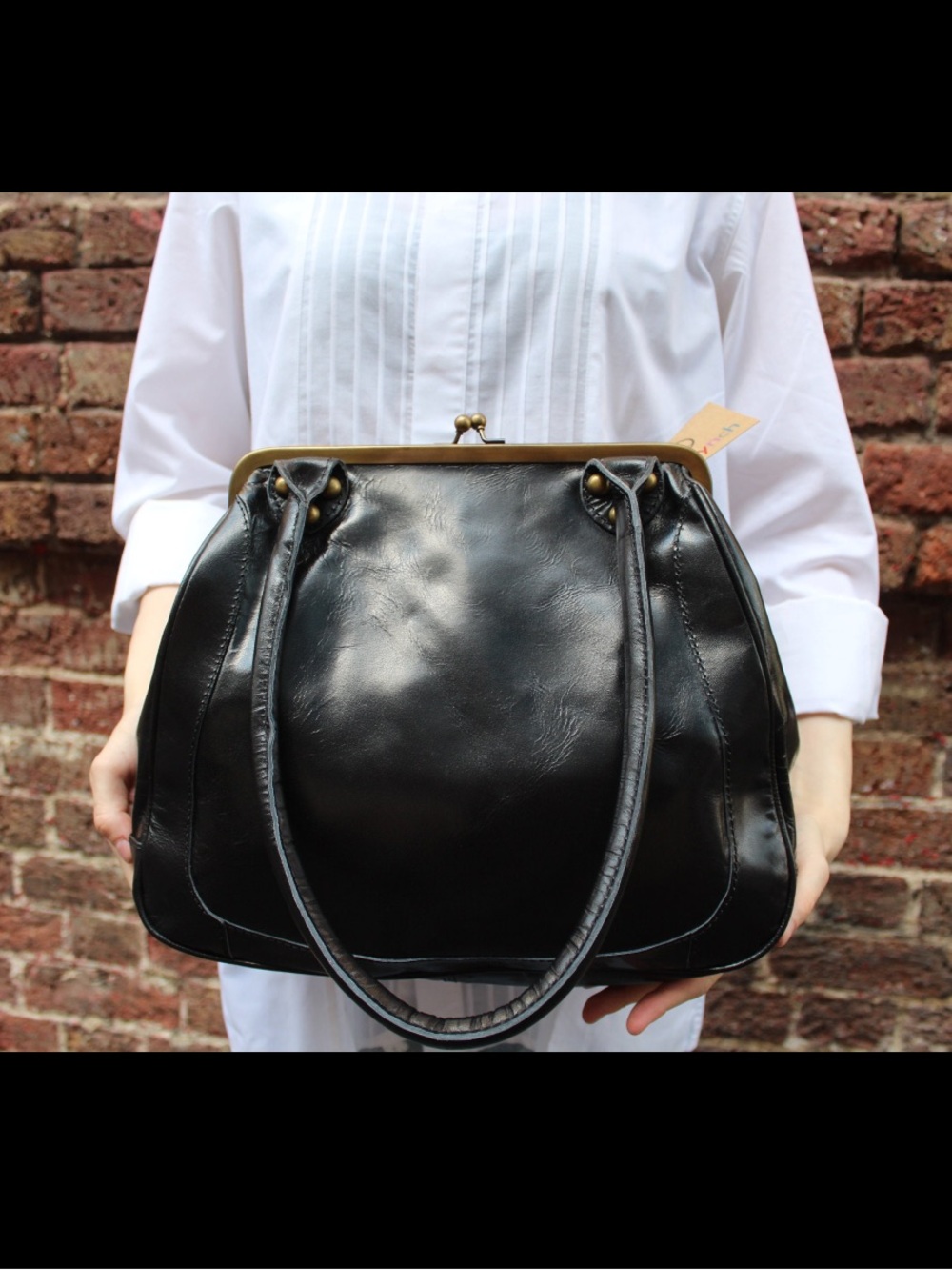 Black Leather Kisslock Handbag